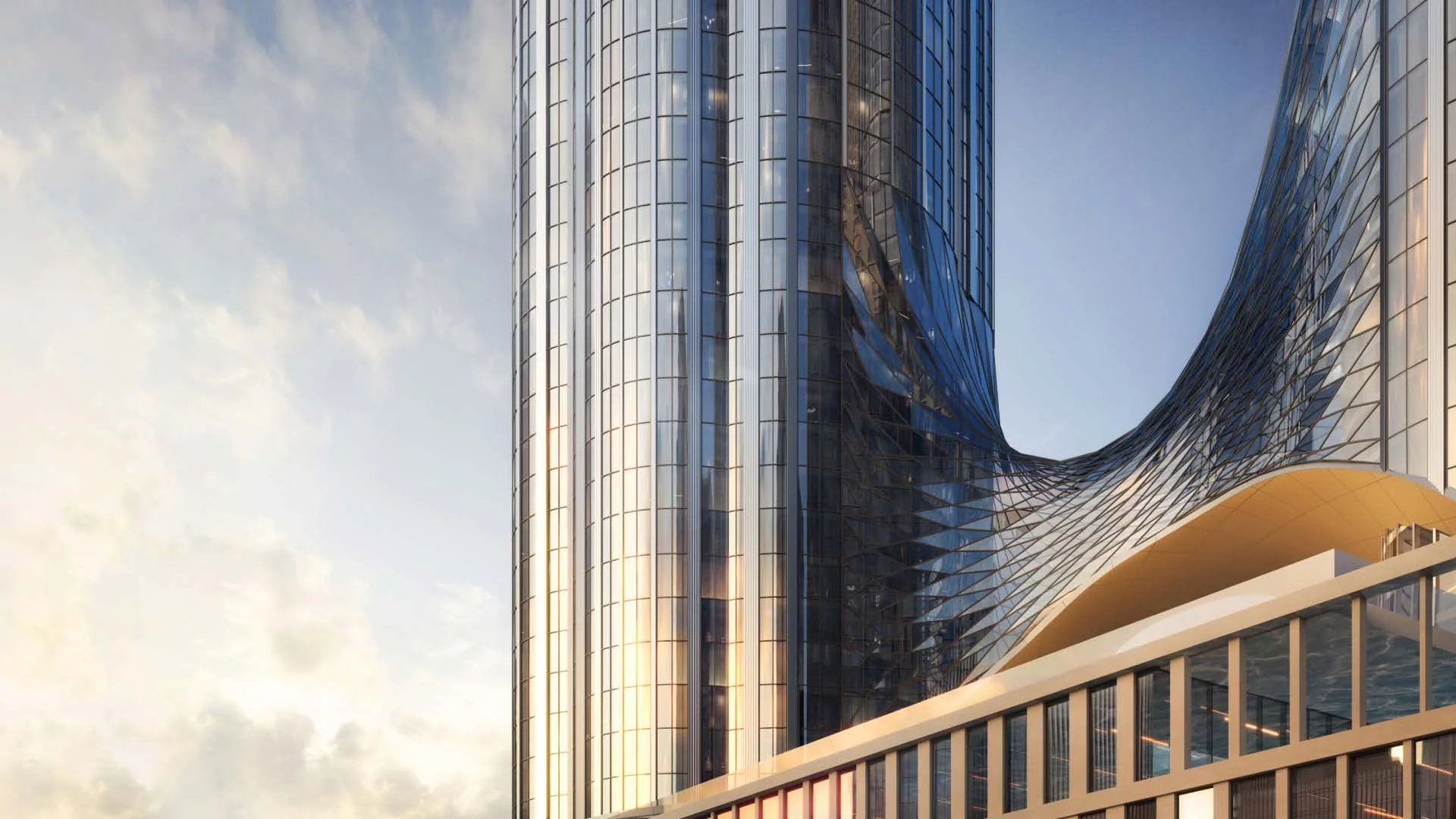 Изгиб стеклянного фасада башни AURUS Residences в золотой час, переход между корпусами